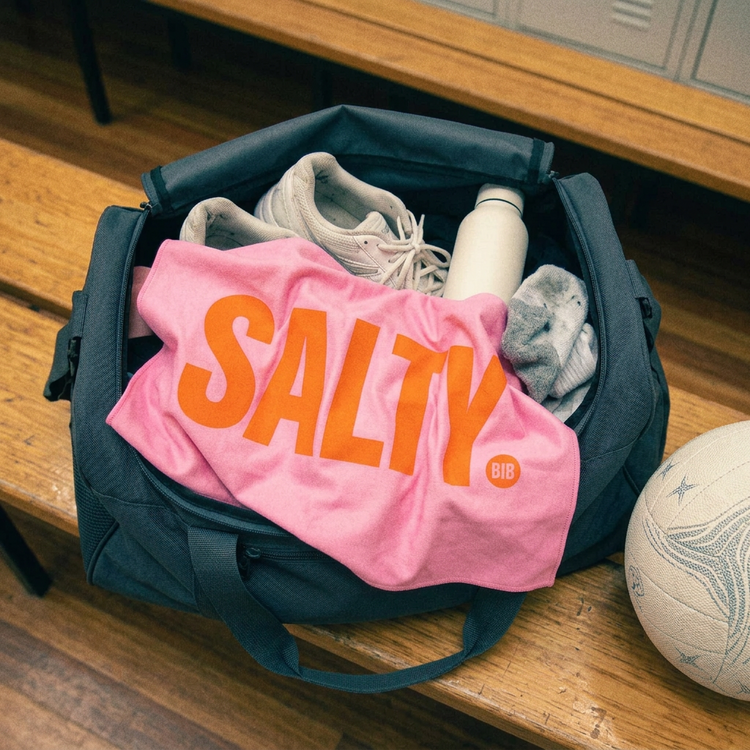 Overhead sports kit bag with crumpled SALTY sweat towel